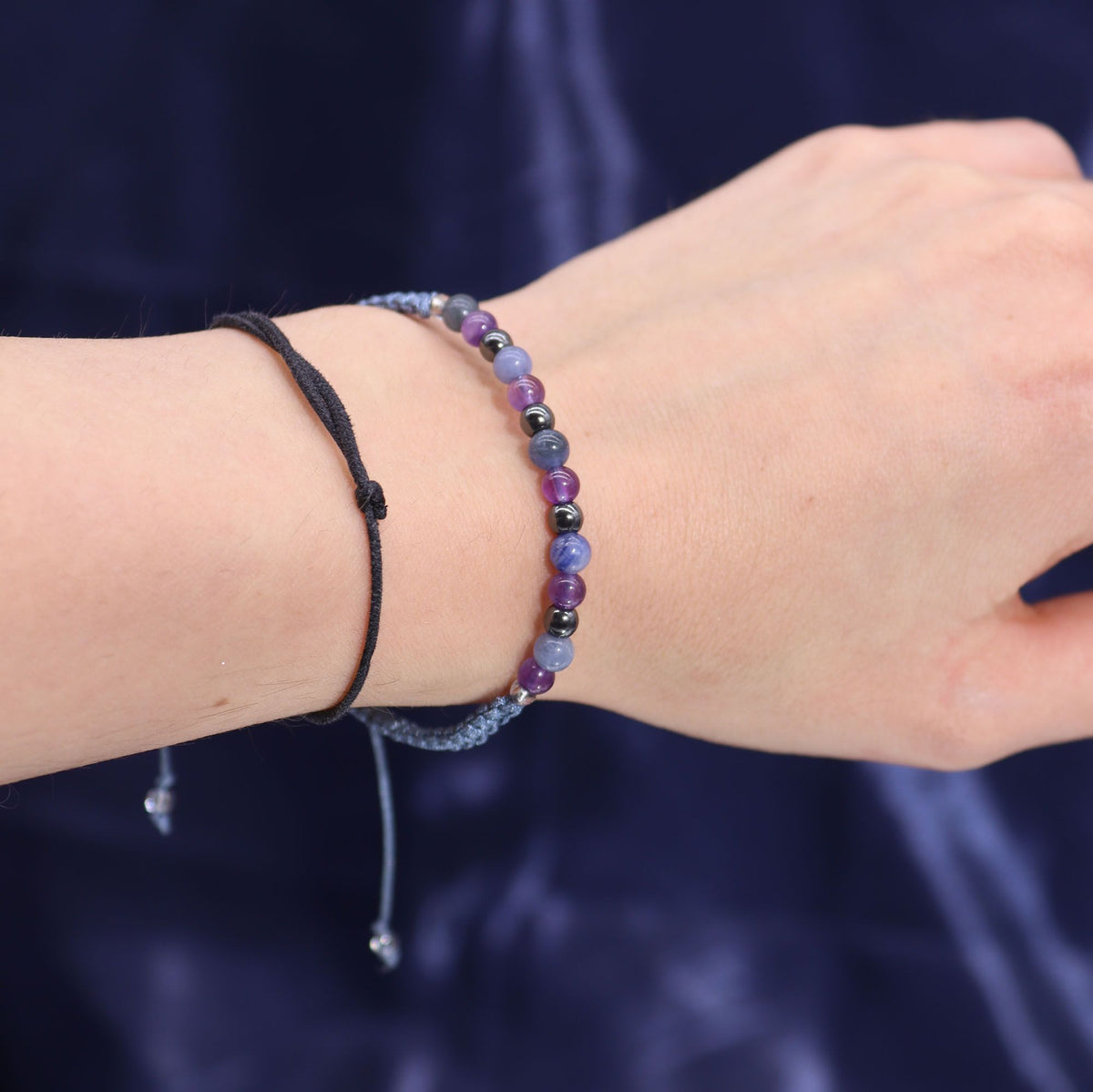 Kristallkerze Schütze – Sternzeichenkerze mit Edelsteinarmband