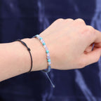 Kristallkerze Fische – Sternzeichenkerze mit Edelsteinarmband