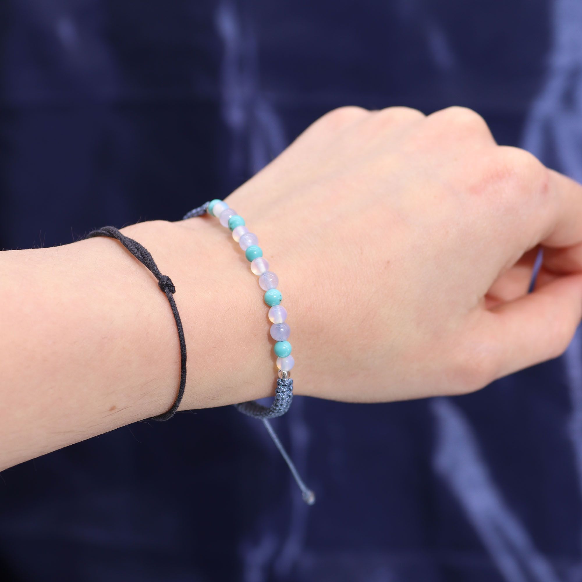 Kristallkerze Fische – Sternzeichenkerze mit Edelsteinarmband